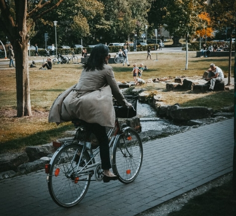 A woman rides a bike